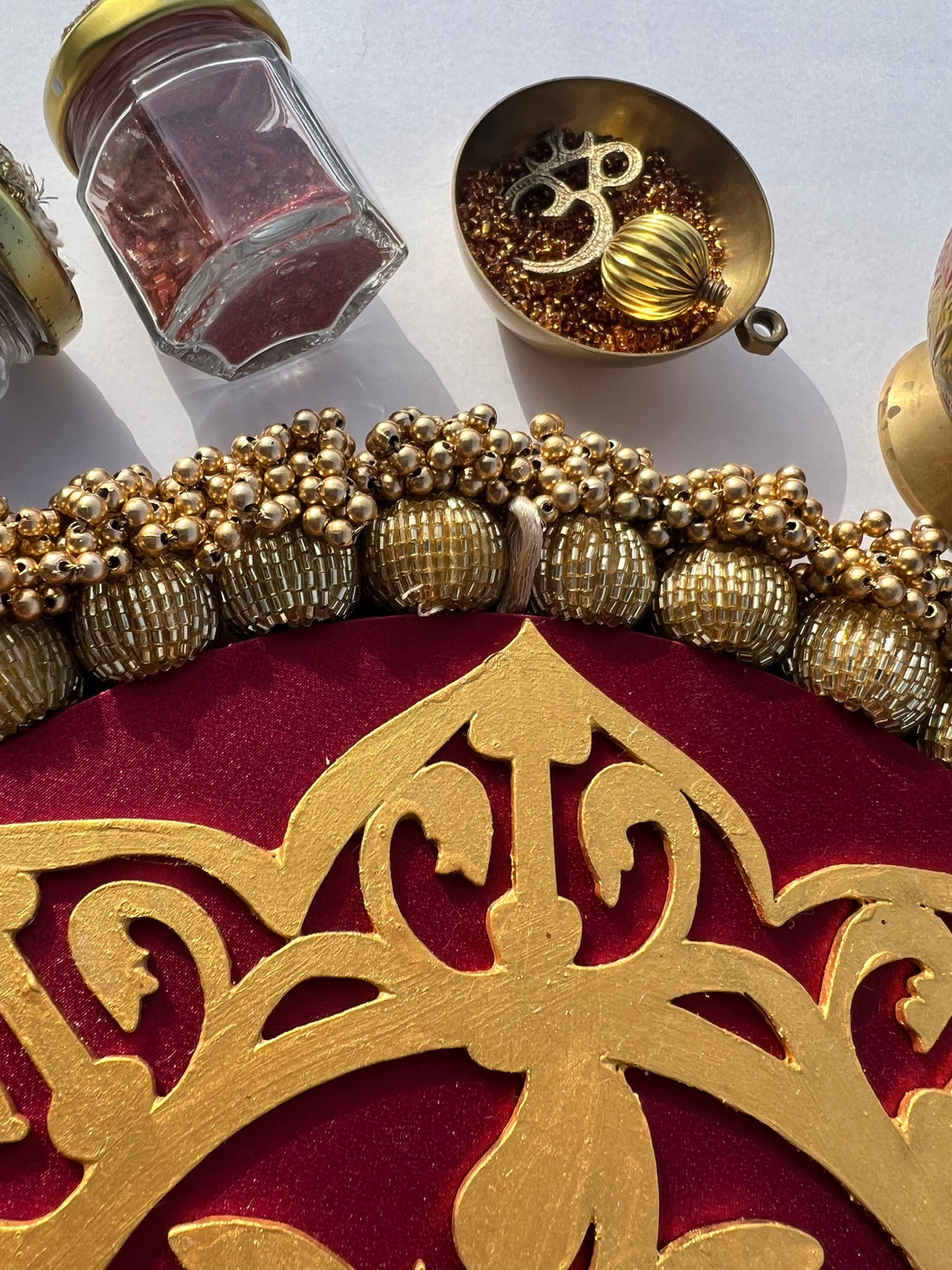 Blossom Ganesh Platter: Solid Maroon + Kamal Bandhej