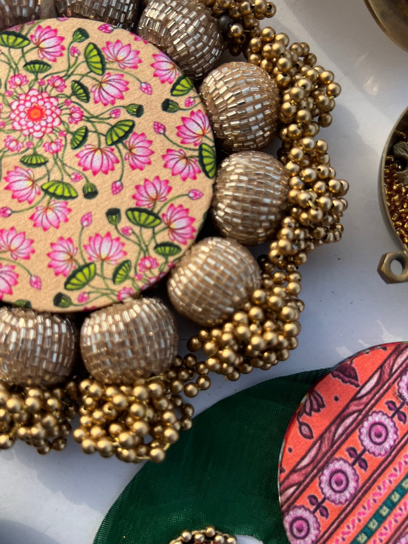 Spherical Mini Platter: Flare Mor Bani Thangat Kare + Pastel Pistachio Inflorescence Divine Pichwai
