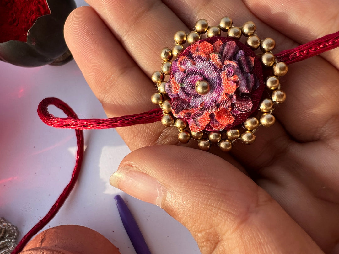 Maroon Navratna Patola Mini Beaded Enchanted Rakhi