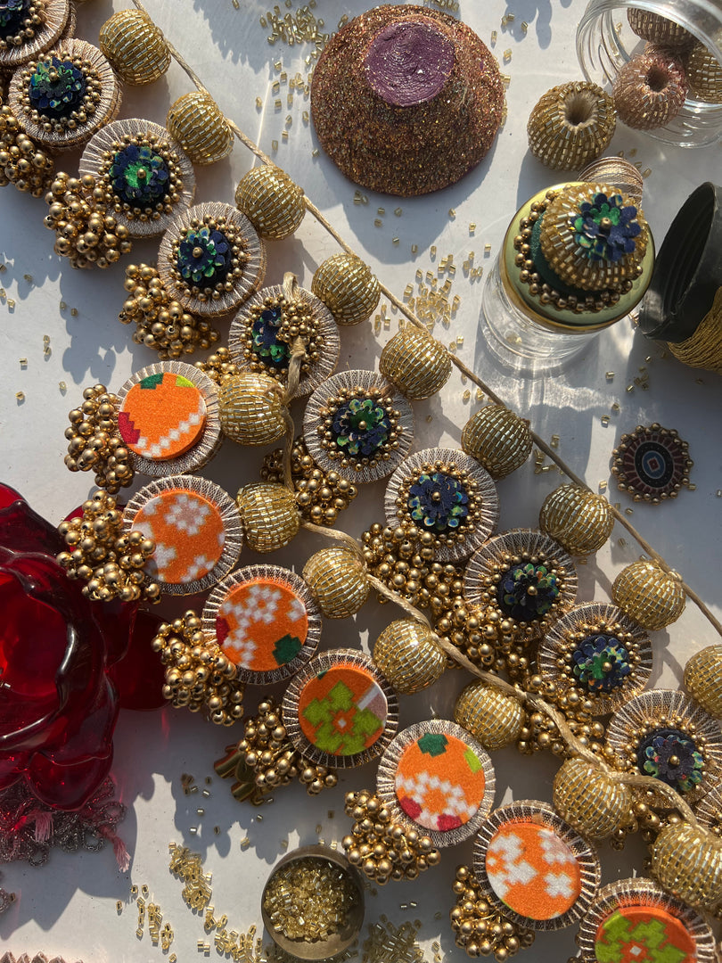 The Ready To Glam Vermillion + Yellow Congruous Divine Pichwai Glass Lumba Toran (Flexible)