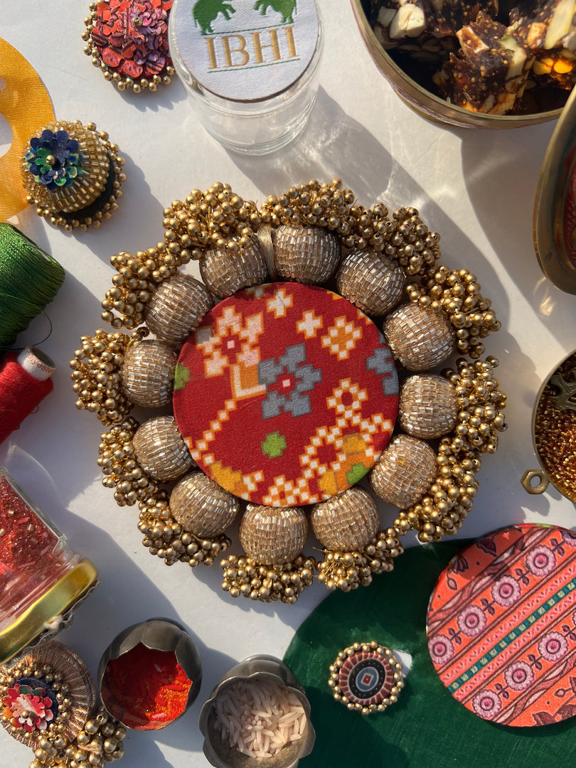 Spherical Mini Platter: Flare Mor Bani Thangat Kare + Pastel Pistachio Inflorescence Divine Pichwai