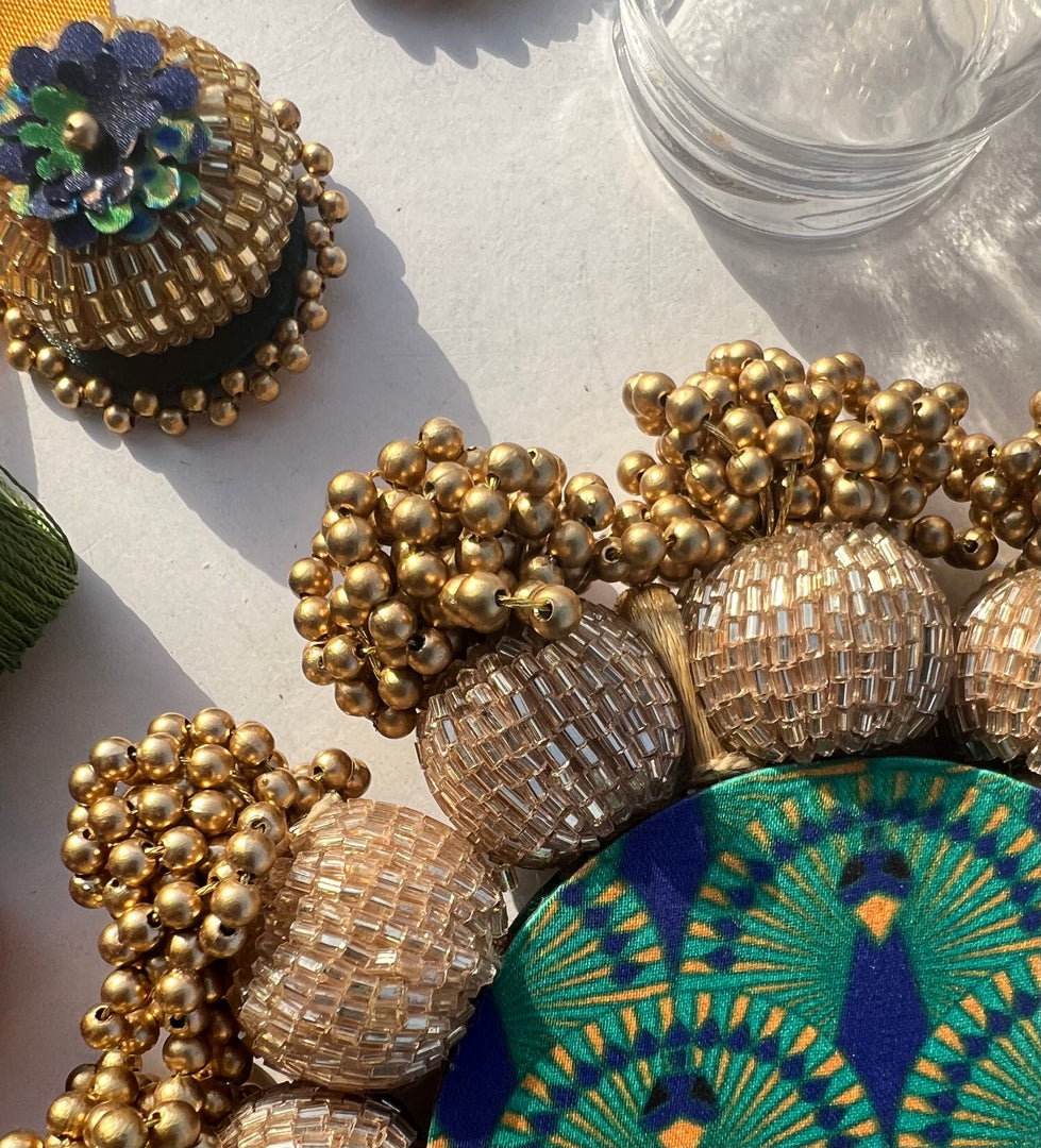 Spherical Mini Platter: Flare Mor Bani Thangat Kare + Pastel Pistachio Inflorescence Divine Pichwai