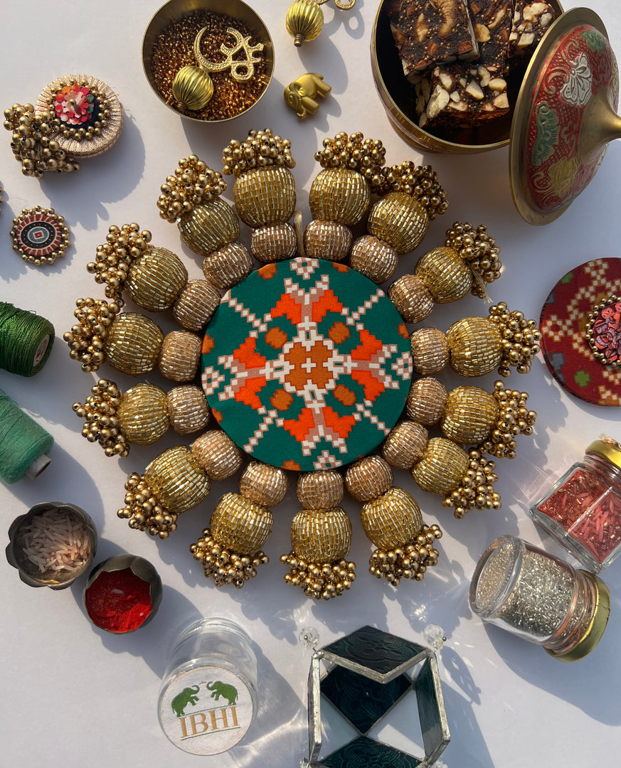 Spherical Chaandbali OG Inflorescence Divine Pichwai and Maroon Navratna Patola Diya Pallet