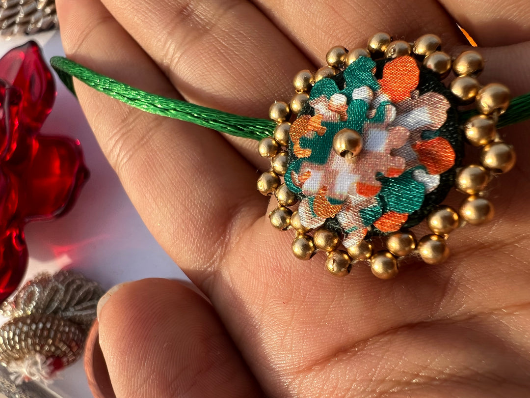 Maroon Navratna Patola Mini Beaded Enchanted Rakhi