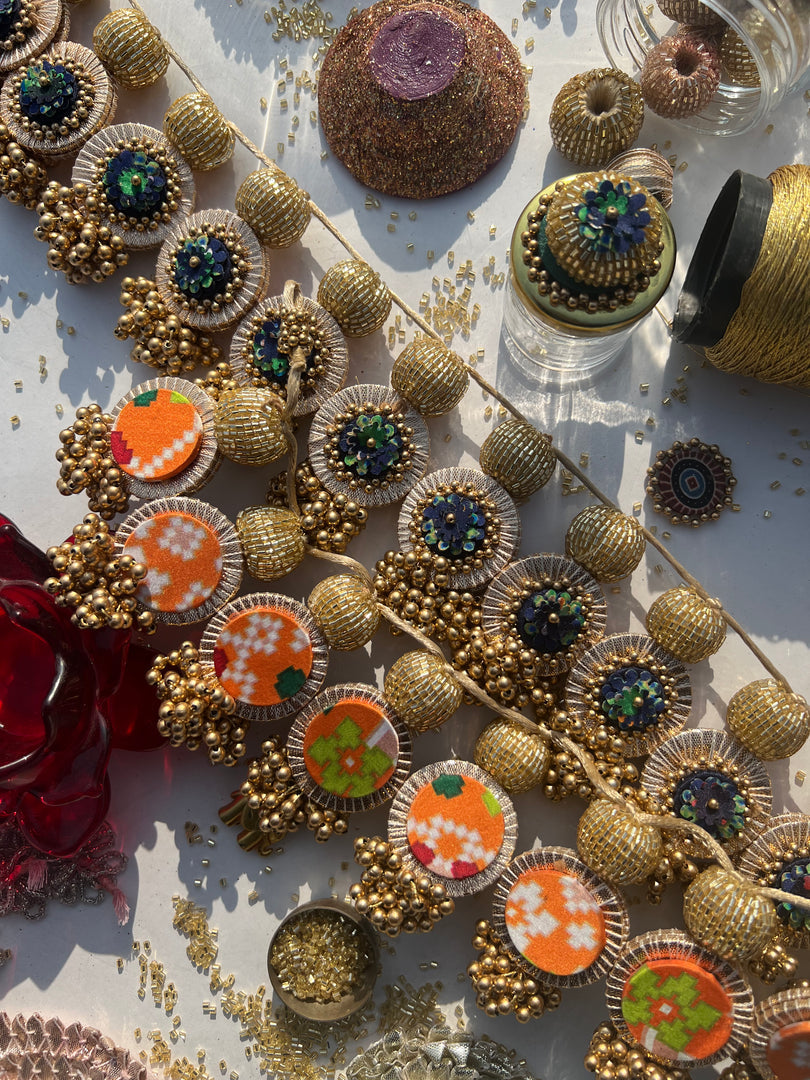 The Ready To Glam Vermillion + Yellow Congruous Divine Pichwai Glass Lumba Toran (Flexible)