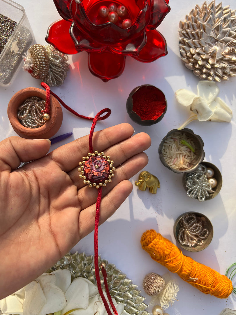 Maroon Navratna Patola Mini Beaded Enchanted Rakhi