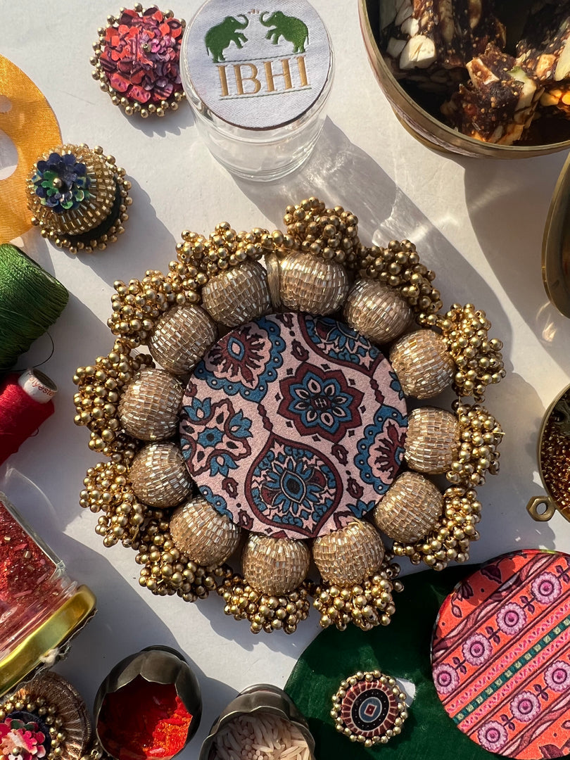 Spherical Mini Platter: Flare Mor Bani Thangat Kare + Pastel Pistachio Inflorescence Divine Pichwai