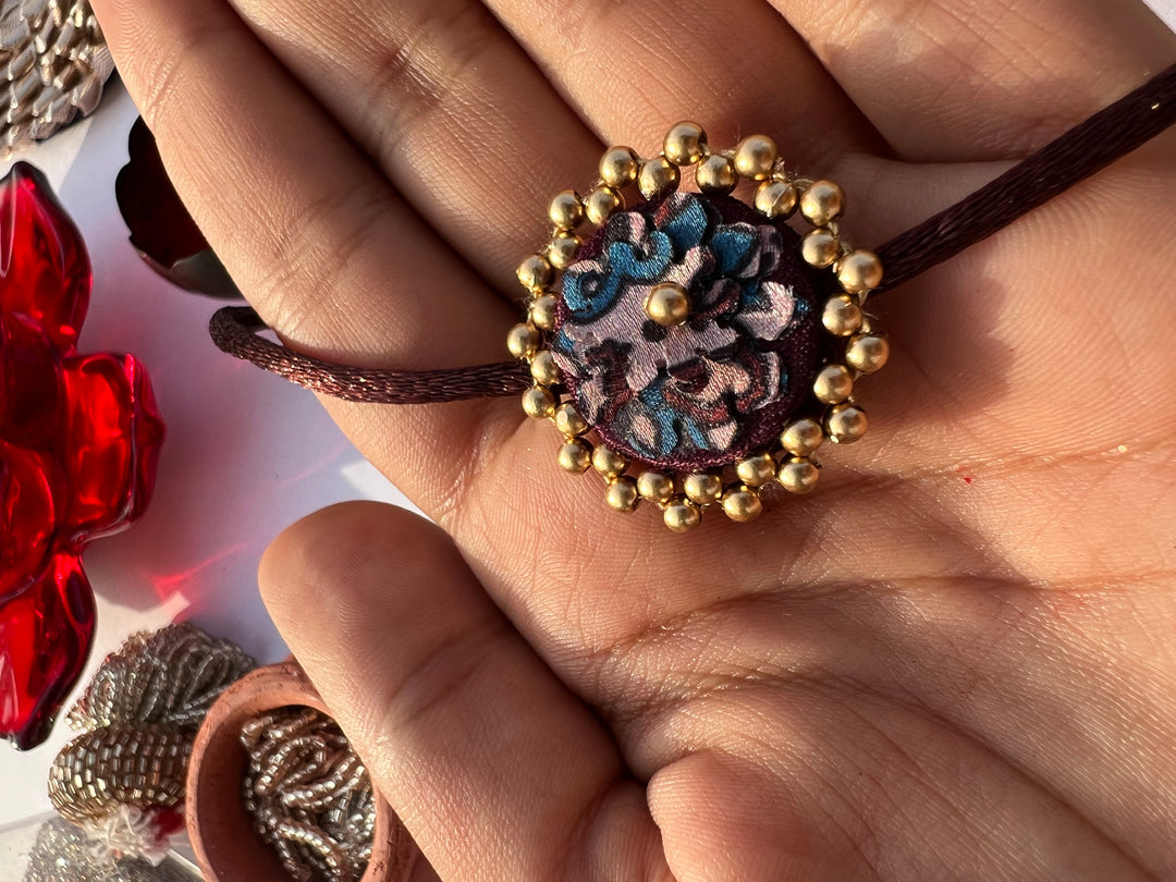 Maroon Navratna Patola Mini Beaded Enchanted Rakhi