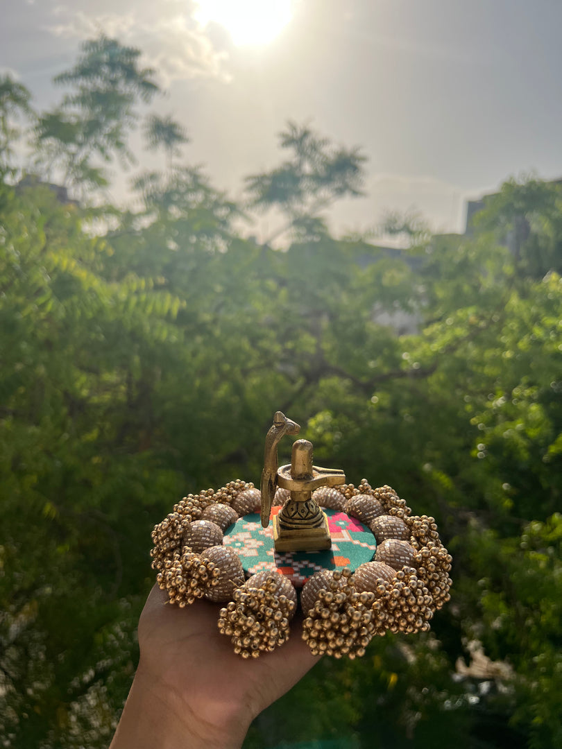 Spherical Mini Platter: Flare Mor Bani Thangat Kare + Pastel Pistachio Inflorescence Divine Pichwai