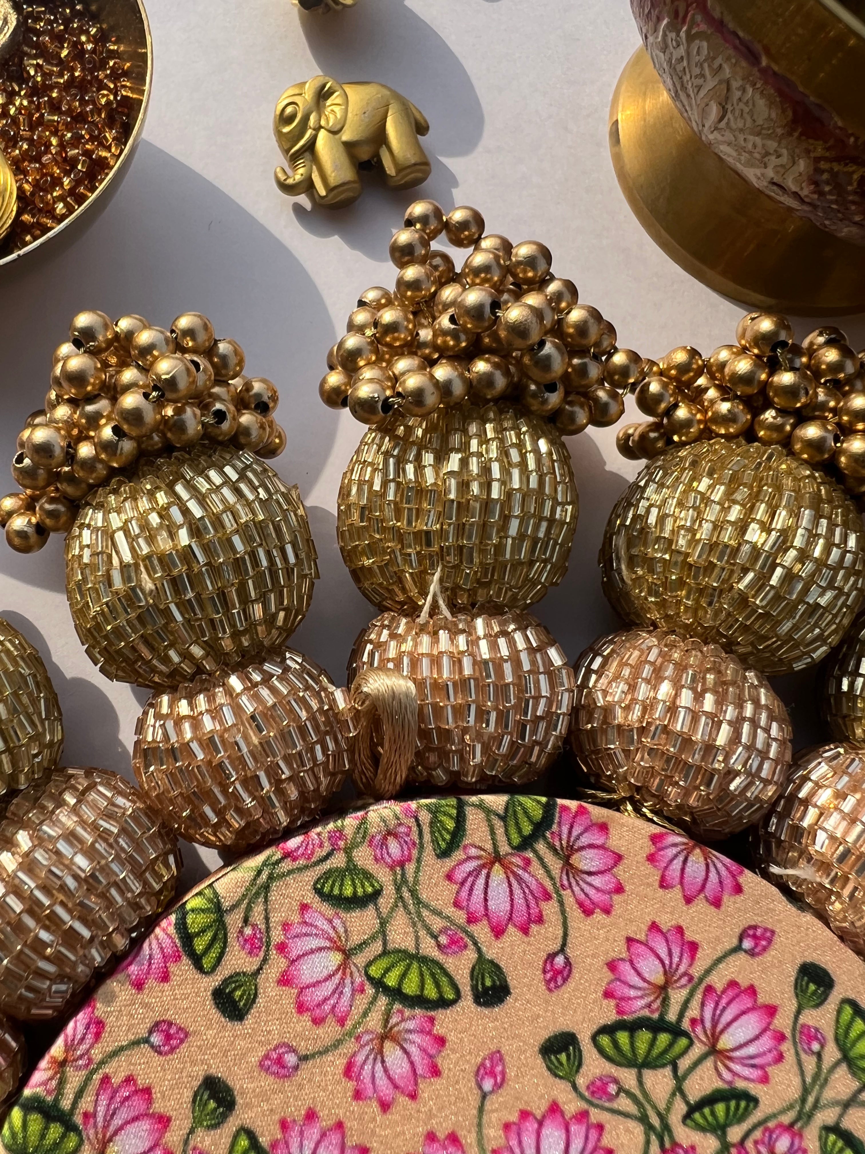 Spherical Chaandbali OG Inflorescence Divine Pichwai and Maroon Navratna Patola Diya Pallet