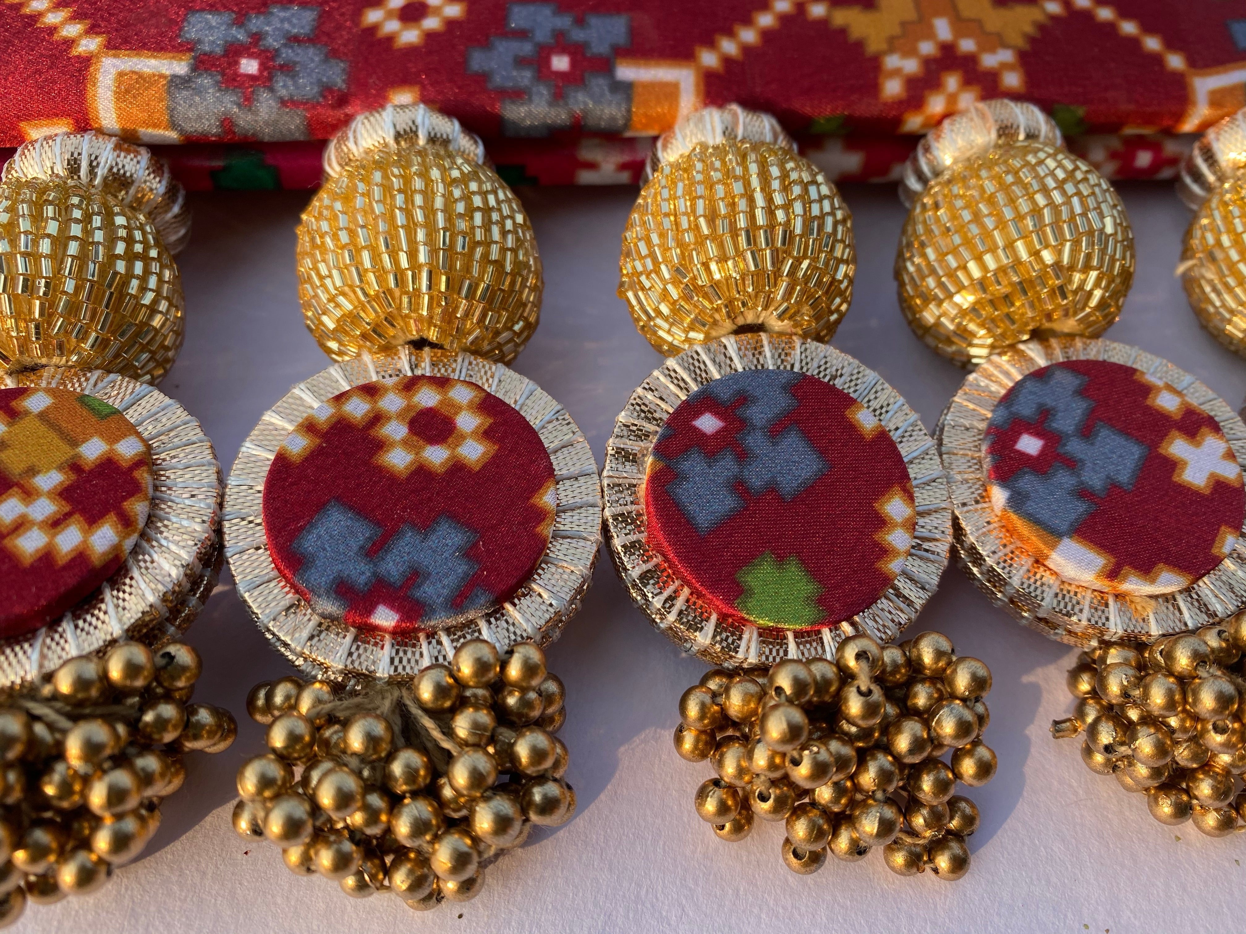 Chic-O-Fleek Sleek Toran : Maroon & Pink Navratna Patola X Glass Rhapsody Toran