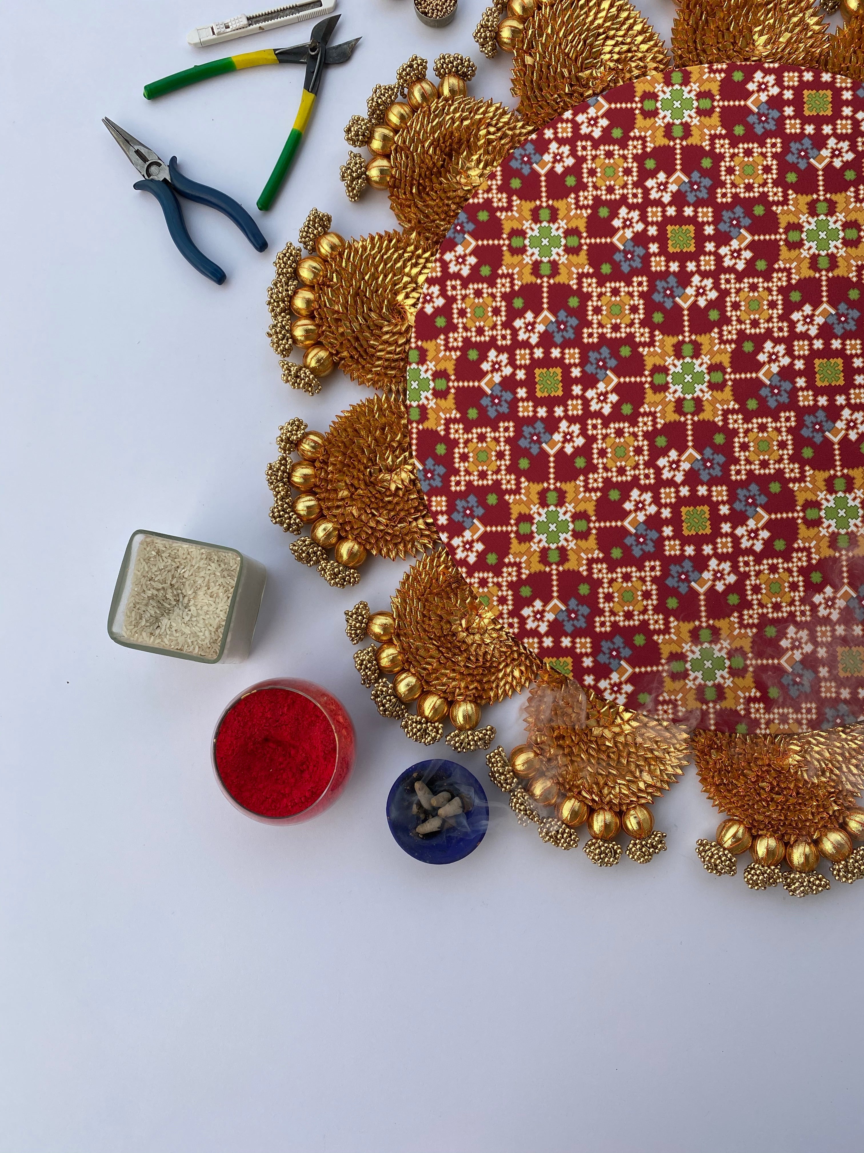 The Maroon Navratna Gota Scallop Rangoli