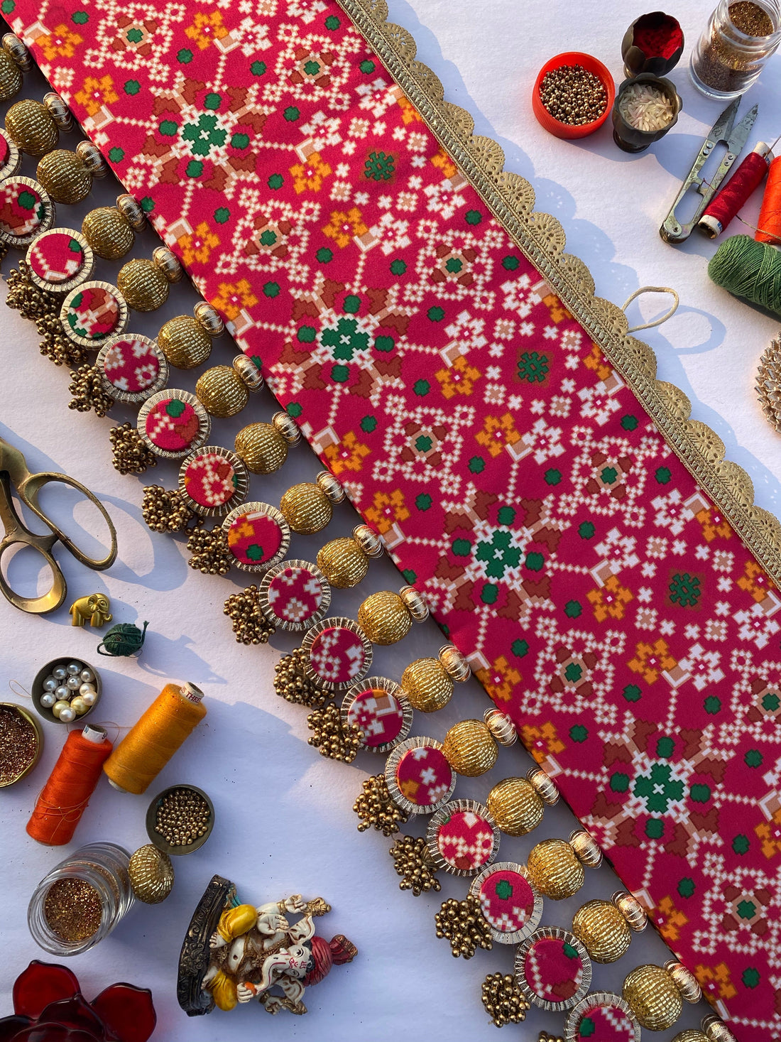 Chic-O-Fleek Sleek Toran : Maroon & Pink Navratna Patola X Glass Rhapsody Toran