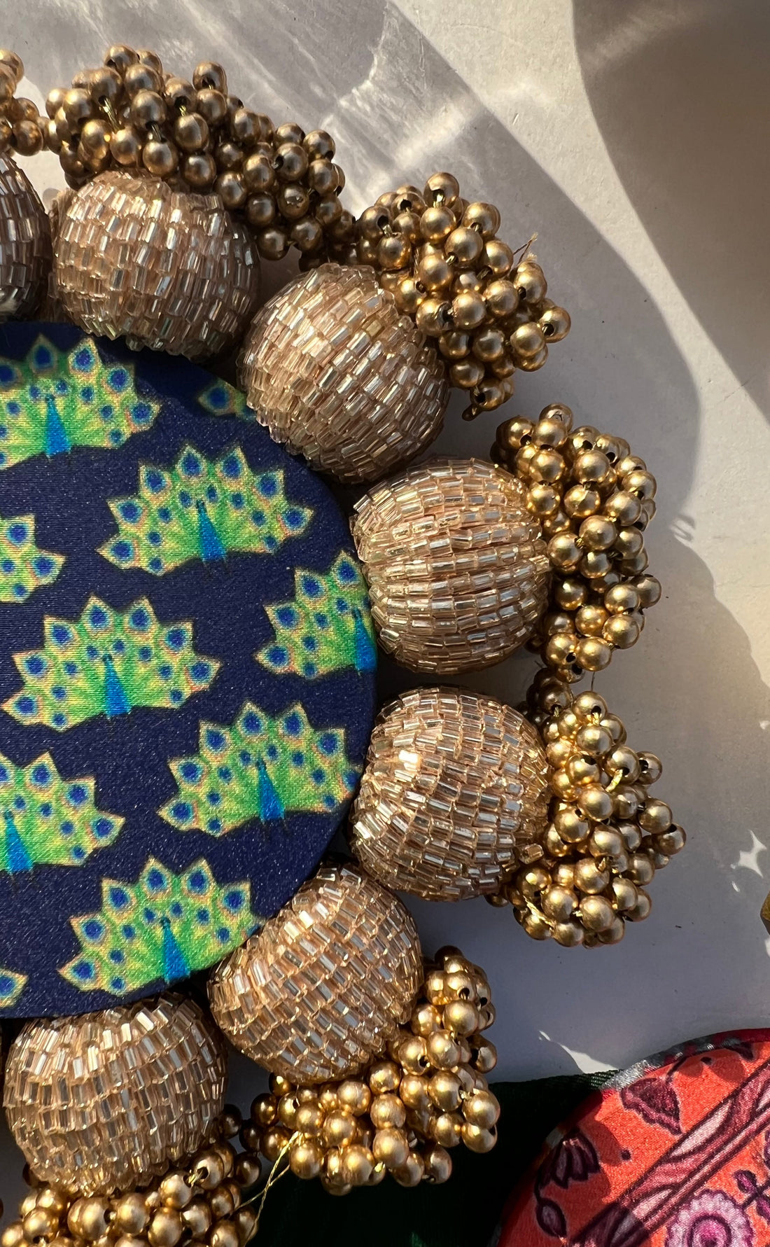 Spherical Mini Platter: Flare Mor Bani Thangat Kare + Pastel Pistachio Inflorescence Divine Pichwai