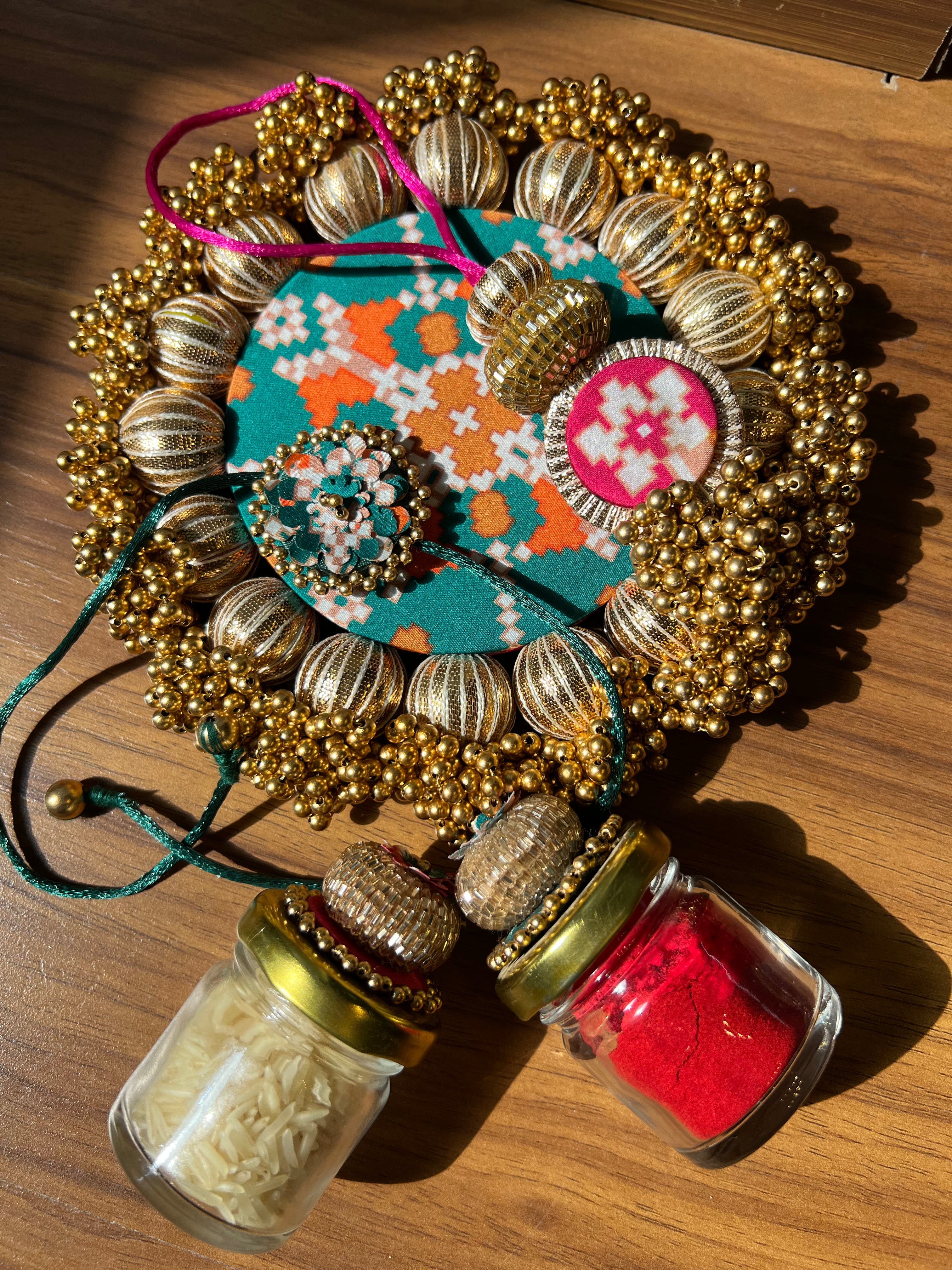Joker Poker Rakhi set: Bottle Green + Pink Navratna Patola
