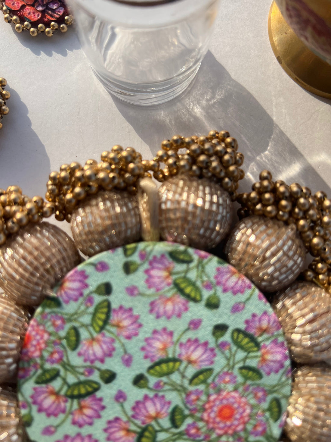 Spherical Mini Platter: Flare Mor Bani Thangat Kare + Pastel Pistachio Inflorescence Divine Pichwai