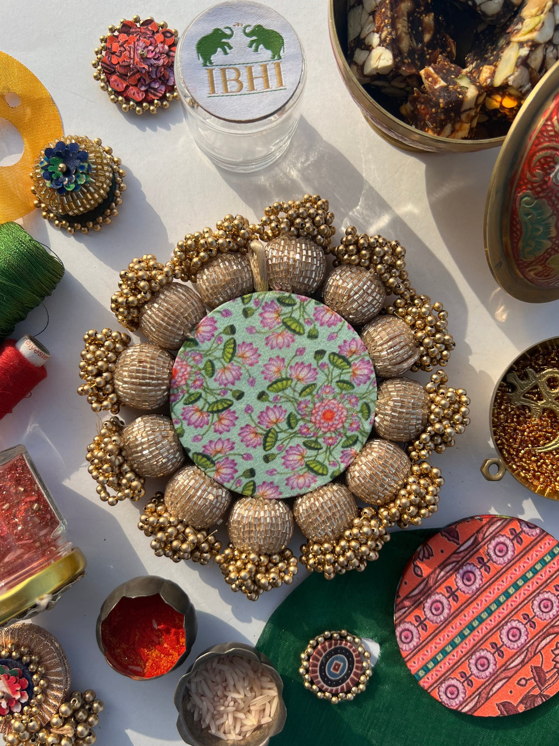 Spherical Mini Platter: Flare Mor Bani Thangat Kare + Pastel Pistachio Inflorescence Divine Pichwai