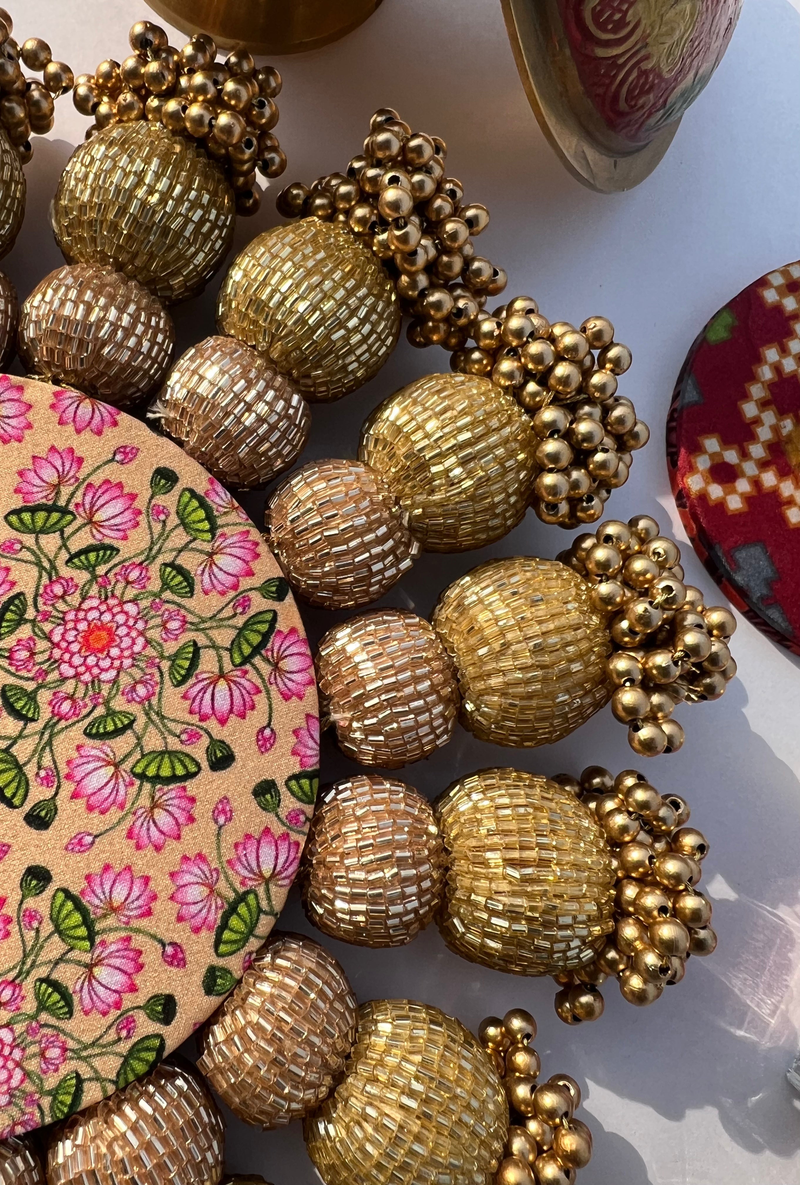 Spherical Chaandbali OG Inflorescence Divine Pichwai and Maroon Navratna Patola Diya Pallet