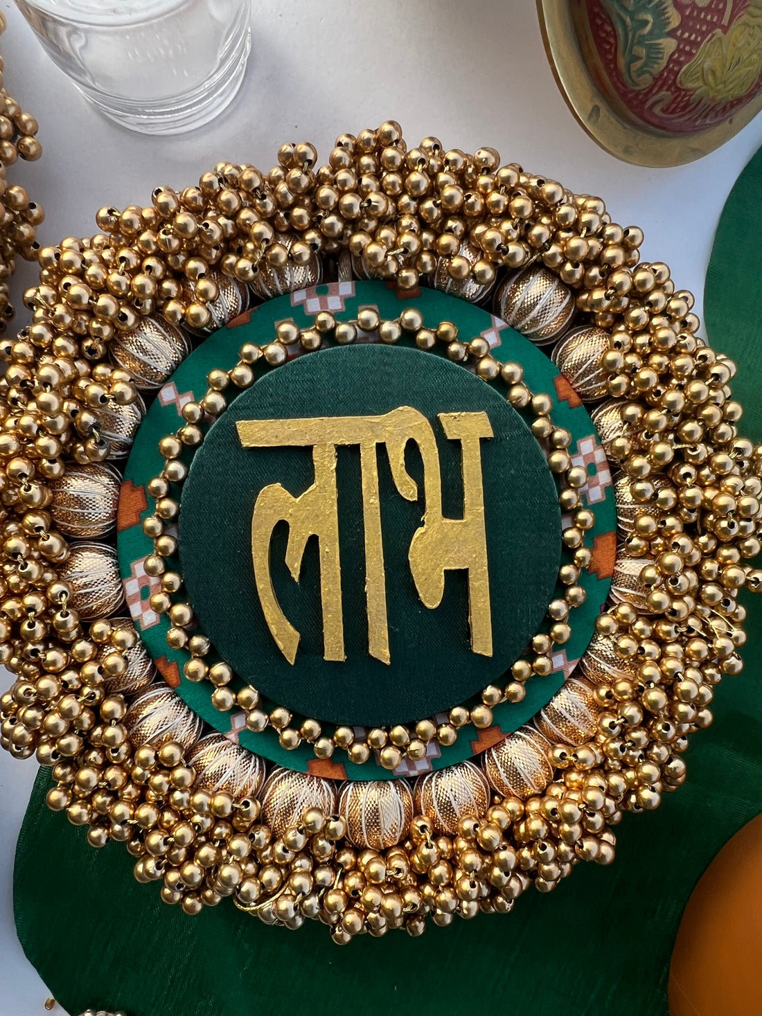 Bottle Green Navratna Patola & Upended Confluence Intense Ajrakh Beaded Shubh Labh Platters- Set of two