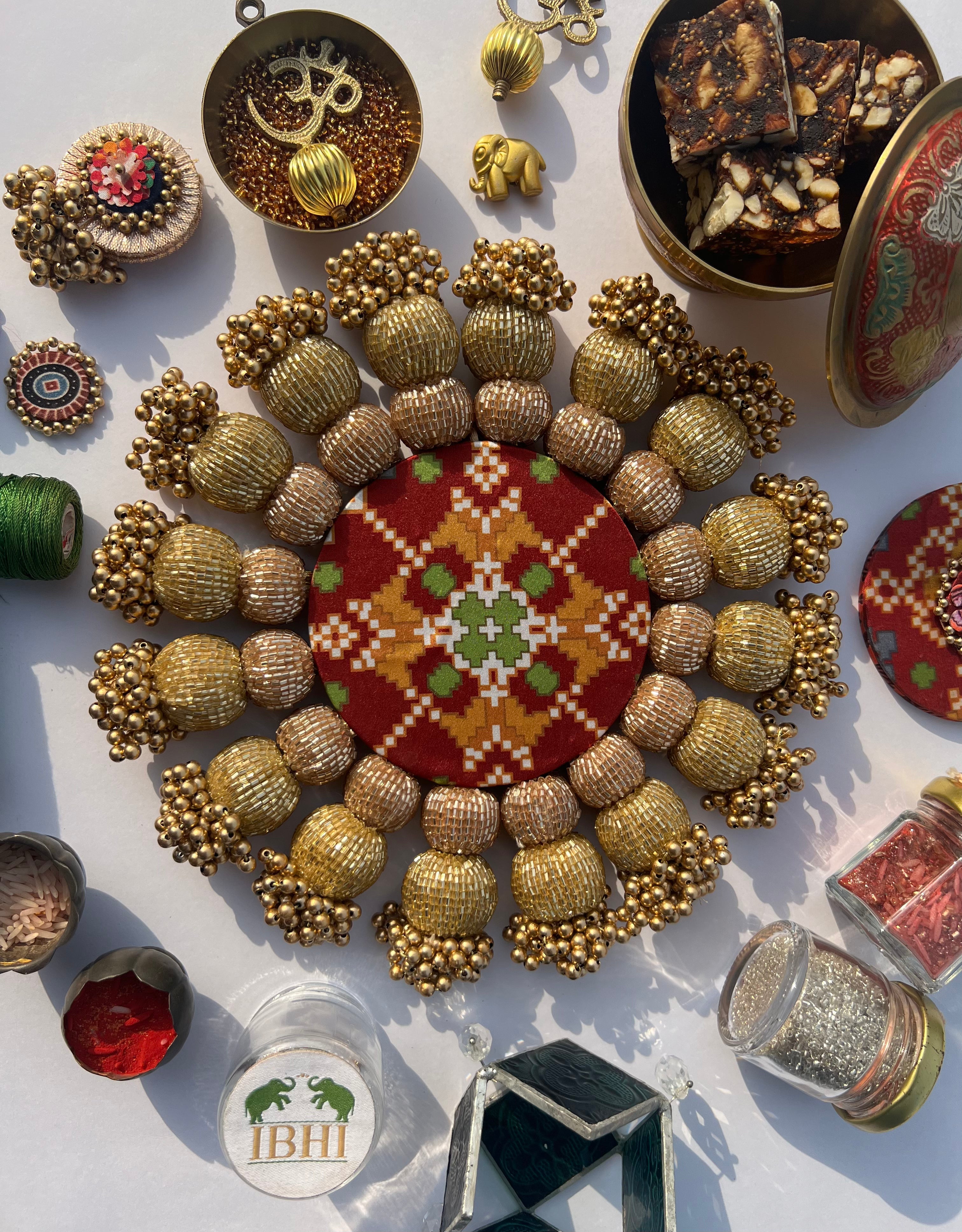 Spherical Chaandbali OG Inflorescence Divine Pichwai and Maroon Navratna Patola Diya Pallet